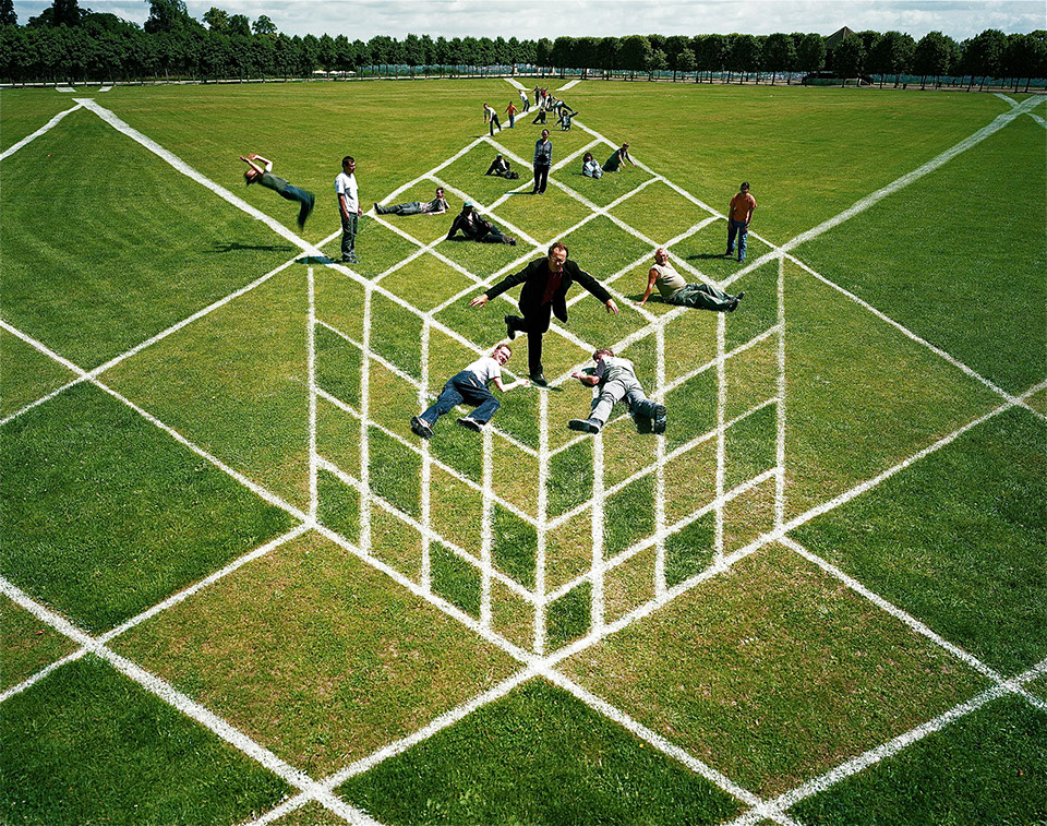 lot of people inside this anaomrphosis image of a 3d cube, in Saint Germain en Laye, near Paris